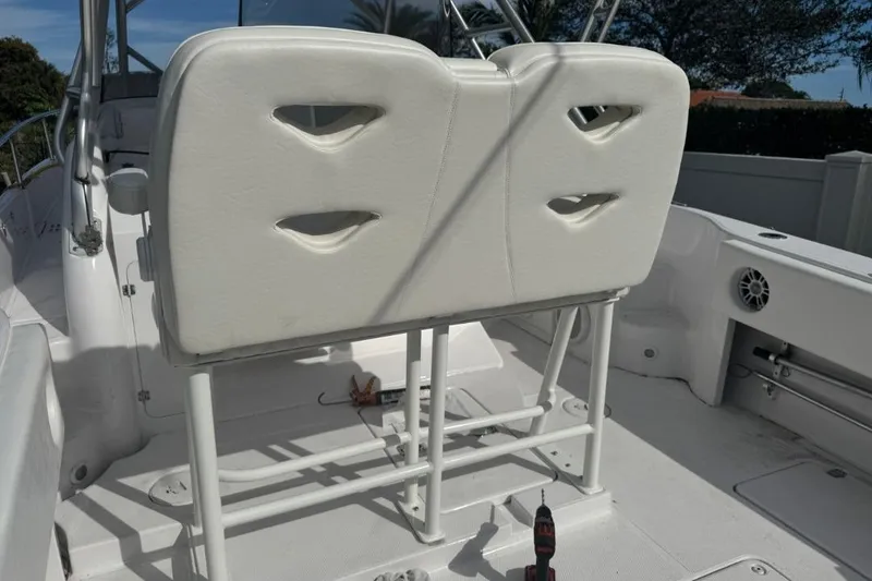 Slide: The Image of 2004 Donzi 38 ZSF boat interior with white seating and deck details. - 7