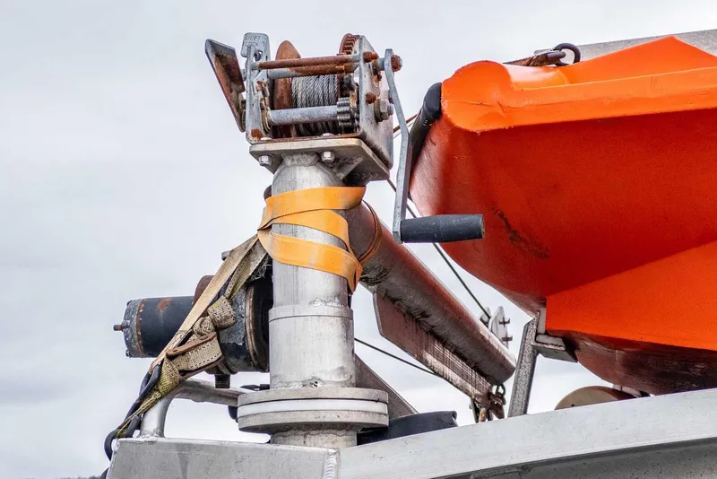 Slide: The Image of Close-up of Lifetimer 3050 Pleasure Cabin boat winch and orange lifeboat, 2003 model. - 12