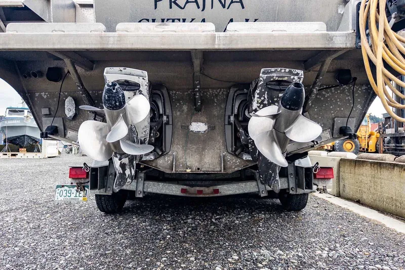 Slide: The Image of Rear view of a 2003 Lifetimer 3050 Pleasure Cabin boat with dual propellers. - 16