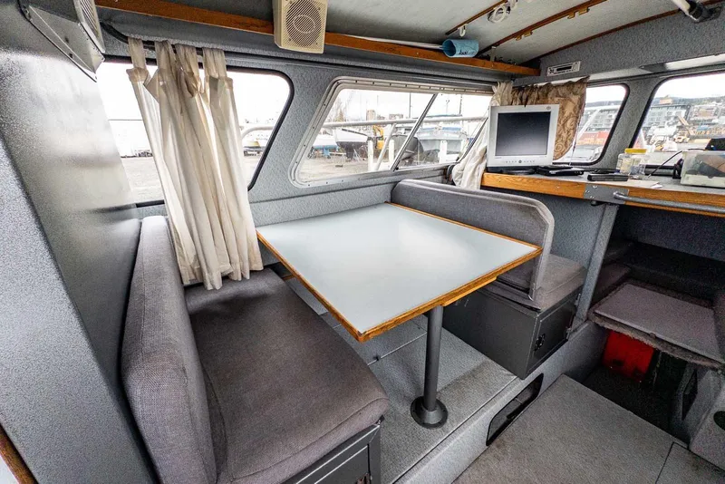 Slide: The Image of Interior of 2003 Lifetimer 3050 Pleasure Cabin with dining area and windows. - 18