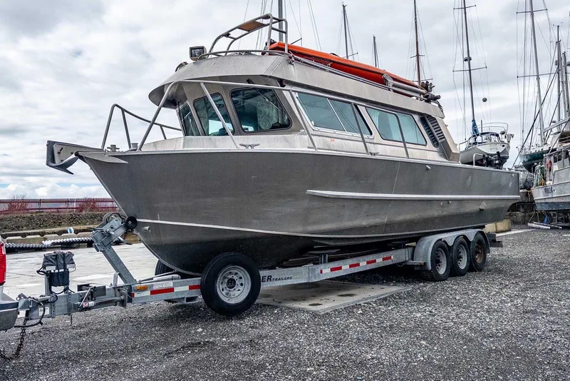 Slide: The Image of 2003 Lifetimer 3050 Pleasure Cabin boat on trailer, parked outdoors. - 5