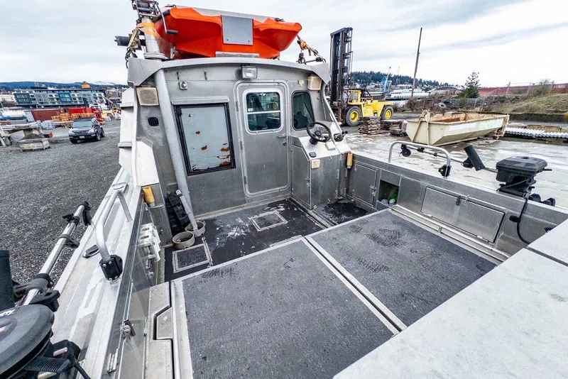 Slide: The Image of 2003 Lifetimer 3050 Pleasure Cabin boat with spacious deck and modern controls. - 8