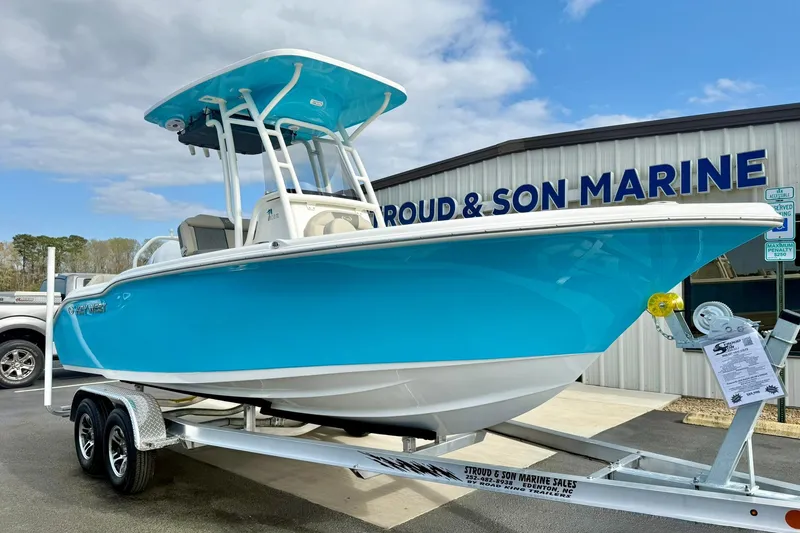 The Image of 2026 Key West 219 FS boat on trailer at marine dealership. - 1