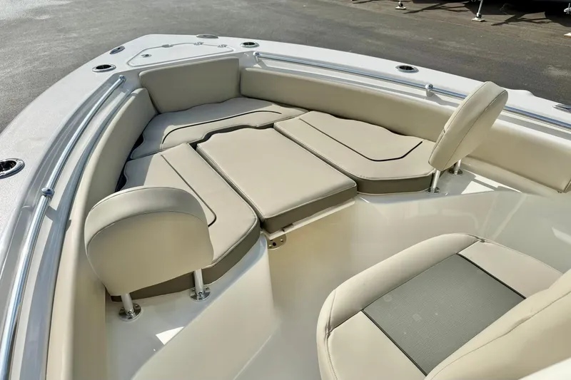 Slide: The Image of 2026 Key West 219 FS boat interior with beige cushioned seating and sleek design. - 11