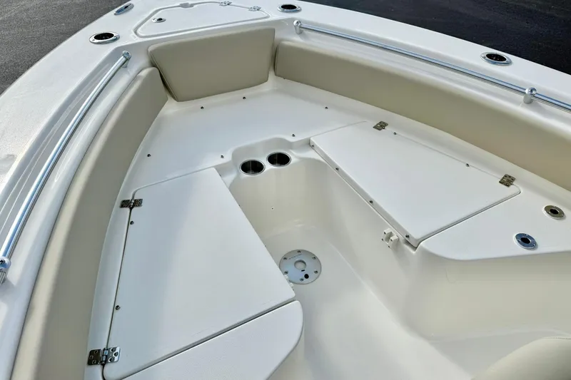 Slide: The Image of 2026 Key West 219 FS boat interior with seating and storage compartments. - 14