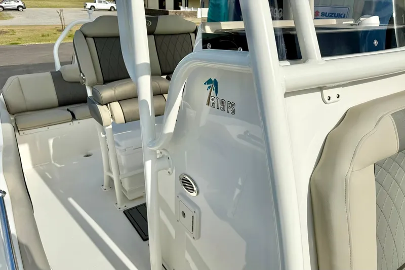 Slide: The Image of 2026 Key West 219 FS boat interior with cushioned seating and sleek design. - 19