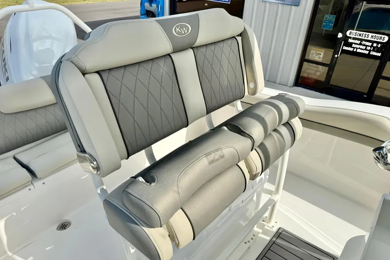 Slide: The Image of 2026 Key West 219 FS boat seating with gray upholstery and diamond stitching. - 20