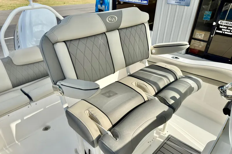 Slide: The Image of 2026 Key West 219 FS boat with luxurious gray seating and armrests. - 21