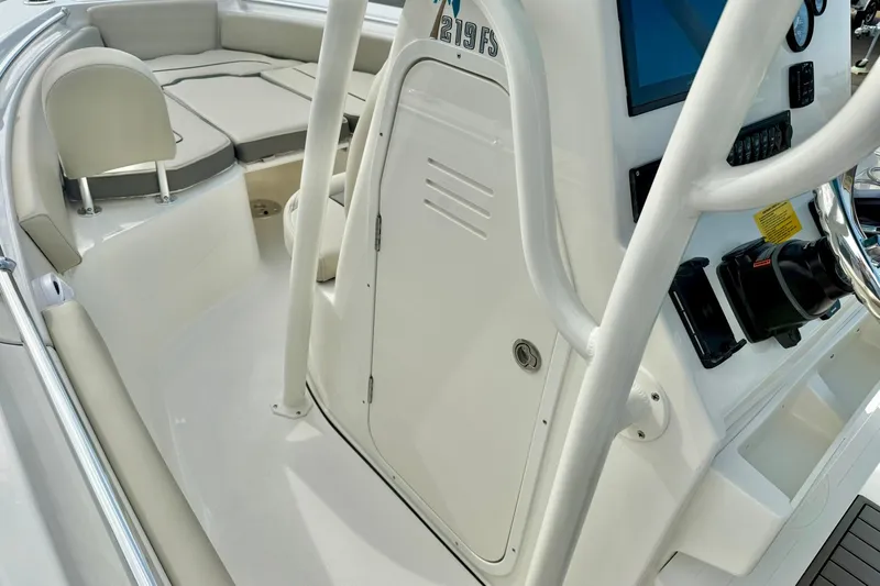 Slide: The Image of 2026 Key West 219 FS boat interior with seating and control panel. - 25