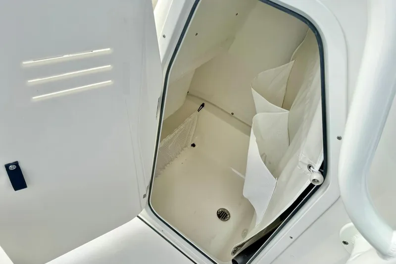 Slide: The Image of Interior view of 2026 Key West 219 FS boat compartment with storage space. - 26