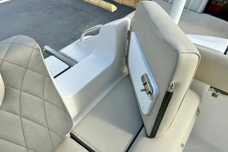 Slide: The Image of 2026 Key West 219 FS boat seat with beige upholstery and stainless steel hardware. - 30