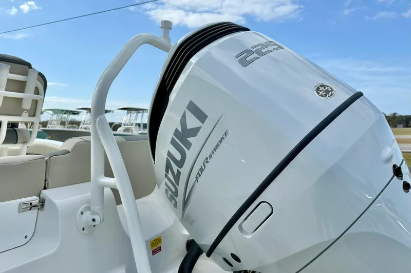 Slide: The Image of 2026 Key West 219 FS boat with Suzuki 225 outboard motor under clear blue sky. - 36