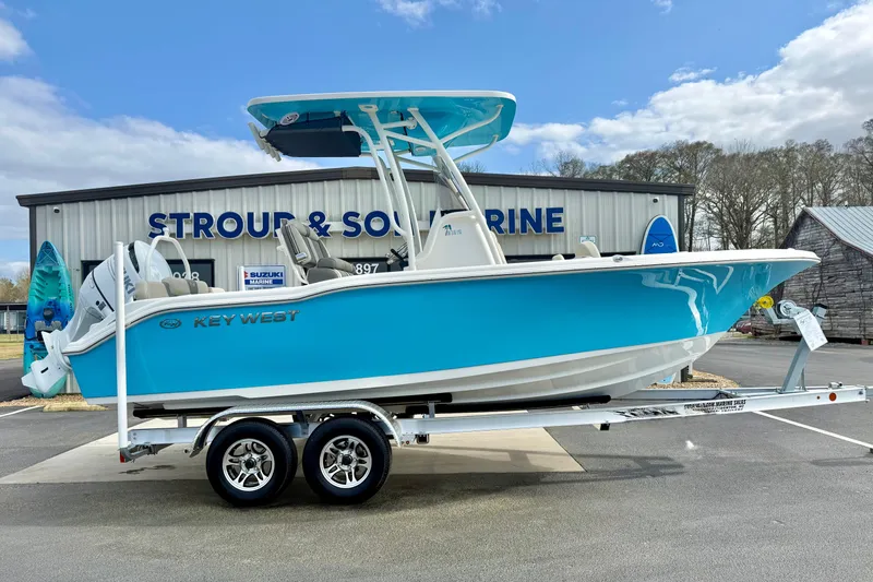 Slide: The Image of 2026 Key West 219 FS boat on trailer at Stroud & Son Marine dealership. - 7