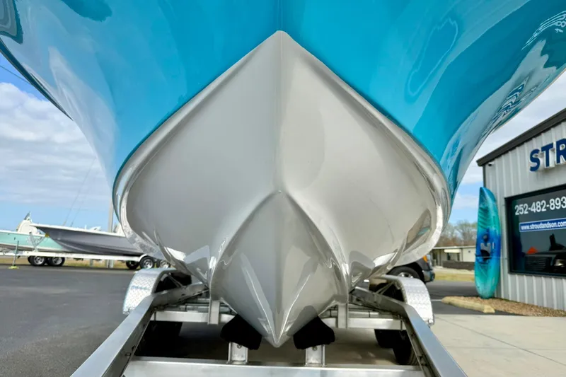 Slide: The Image of 2026 Key West 219 FS boat on trailer, showcasing sleek hull design. - 9