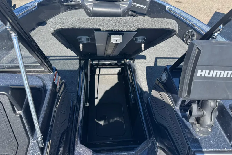 Slide: The Image of 2023 Nitro ZV20 boat interior with open storage compartment and Humminbird electronics. - 14