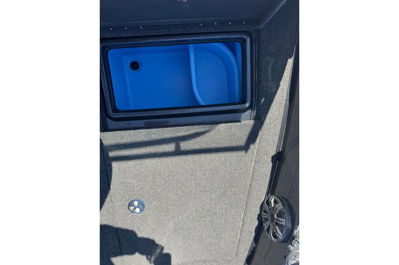 Slide: The Image of 2023 Nitro ZV20 boat interior with blue storage compartment and speaker. - 17