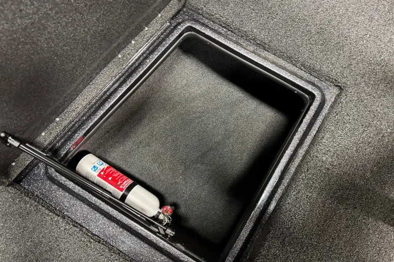 Slide: The Image of Storage compartment in 2023 Nitro ZV20 boat with fire extinguisher. - 22