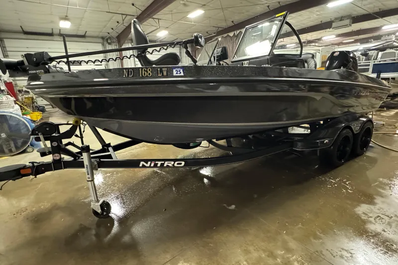 Slide: The Image of 2023 Nitro ZV20 boat on trailer in indoor storage facility. - 24