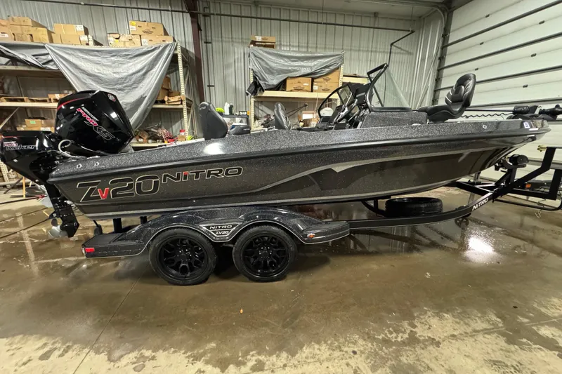 Slide: The Image of 2023 Nitro ZV20 boat in a garage, featuring sleek design and powerful engine. - 27