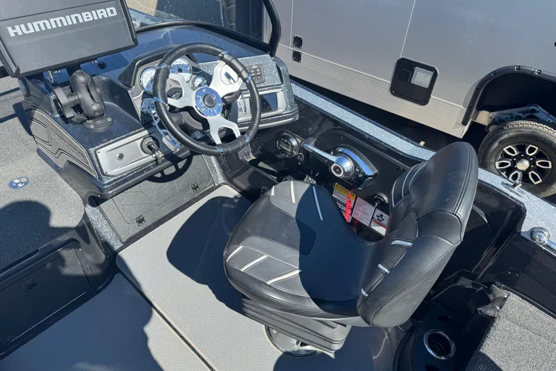 Slide: The Image of 2023 Nitro ZV20 boat cockpit with steering wheel and Humminbird display. - 5