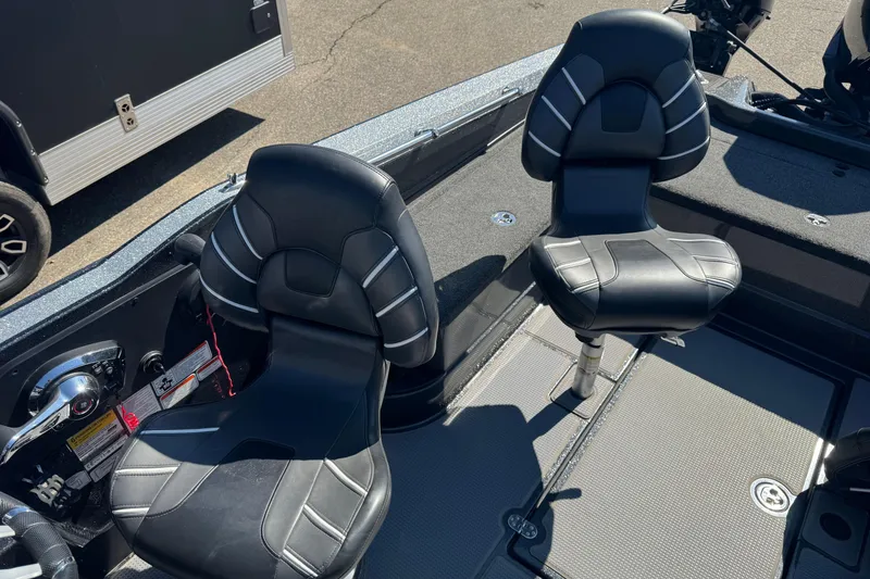 Slide: The Image of Two black seats in a 2023 Nitro ZV20 boat interior. - 9