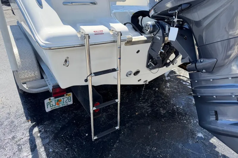 Slide: The Image of Rear view of 2026 Key West 203 FS boat with ladder and motor. - 10