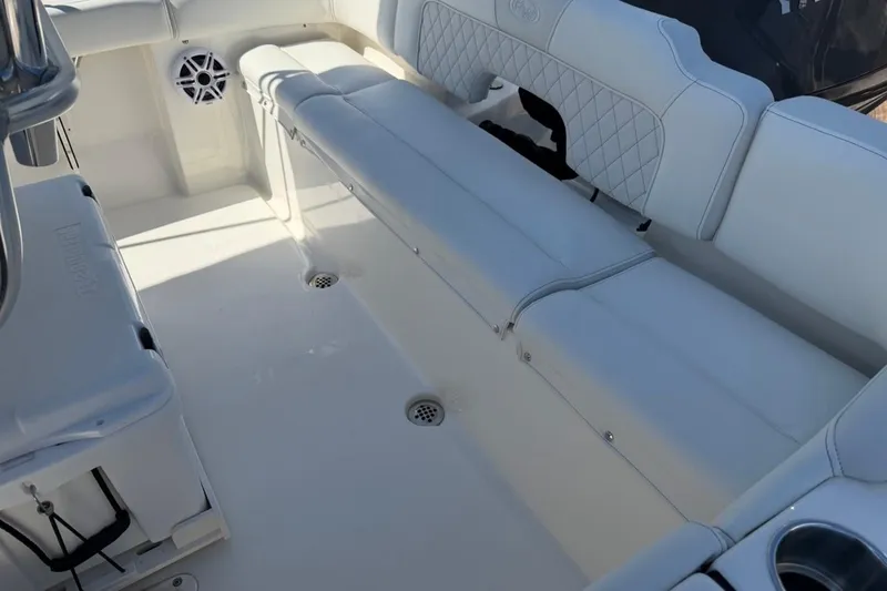 Slide: The Image of Interior of 2026 Key West 203 FS boat with white seating and speaker. - 12