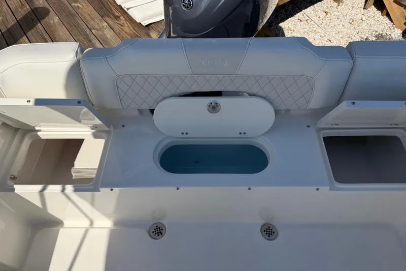 Slide: The Image of 2026 Key West 203 FS boat interior with storage compartments and seating. - 15