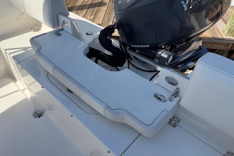 Slide: The Image of 2026 Key West 203 FS boat with Yamaha engine, featuring sleek white seating and deck. - 16