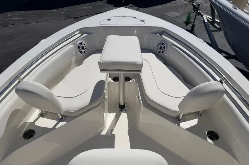 Slide: The Image of 2026 Key West 203 FS boat interior with white seating and stainless steel accents. - 21