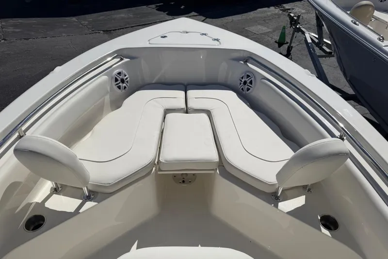 Slide: The Image of Bow seating area of 2026 Key West 203 FS boat with white cushions and speakers. - 22