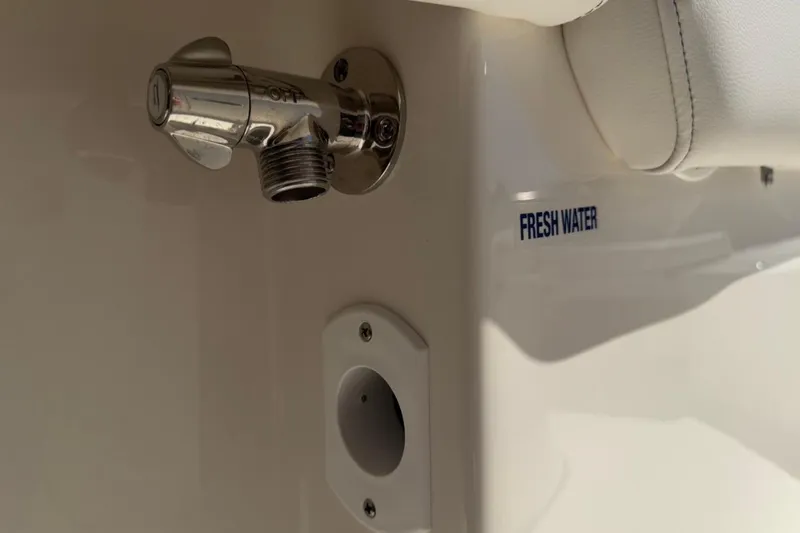 Slide: The Image of Fresh water outlet on 2026 Key West 203 FS boat, featuring chrome finish. - 34