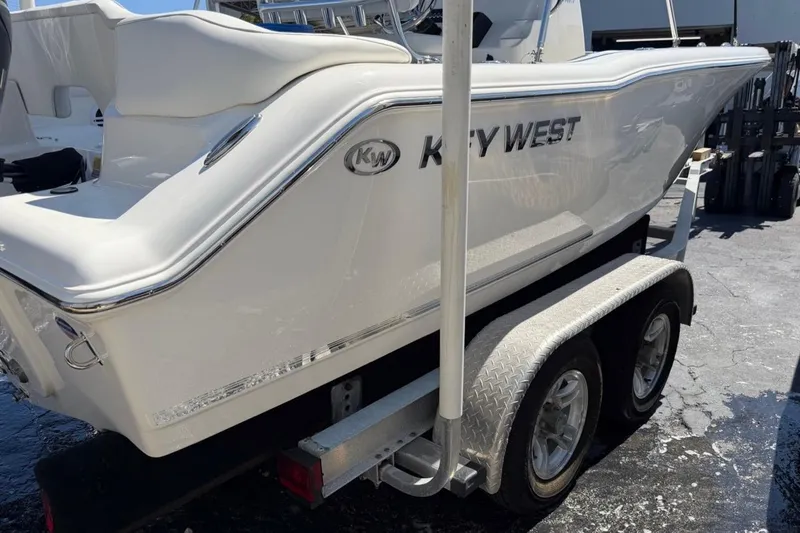 Slide: The Image of 2026 Key West 203 FS boat on trailer, showcasing sleek design and branding. - 6