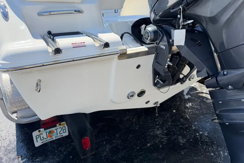 Slide: The Image of Rear view of 2026 Key West 203 FS boat with outboard motor and Florida license plate. - 9