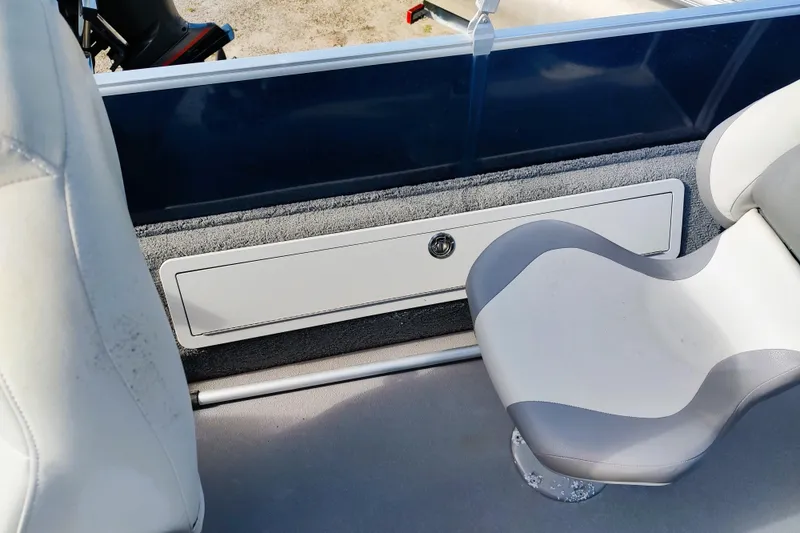 Slide: The Image of 2019 Sylvan Mirage Fish 8520 Party Fish boat interior with seating and storage compartment. - 4