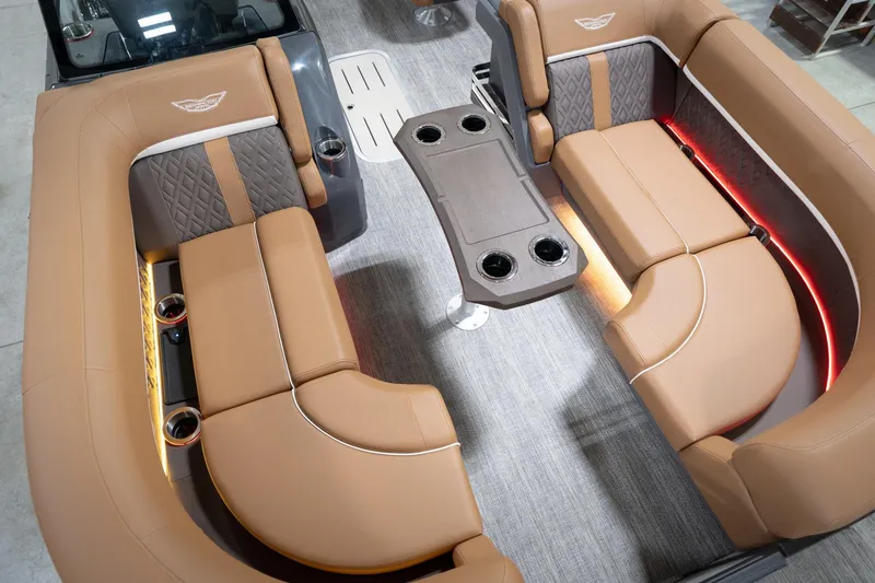Slide: The Image of Luxurious interior of 2026 Bennington 22 MSB pontoon boat with tan seating and LED lighting. - 13