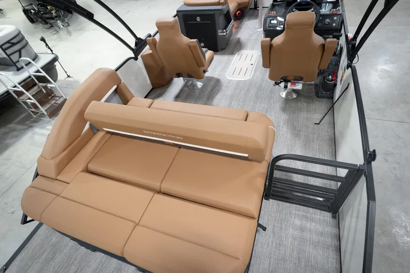 Slide: The Image of 2026 Bennington 22 MSB pontoon boat interior with tan seating and modern helm. - 14