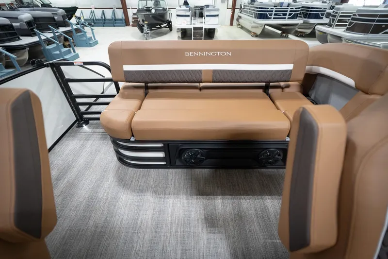 Slide: The Image of Luxurious seating on 2026 Bennington 22 MSB pontoon boat, featuring tan upholstery and modern design. - 18