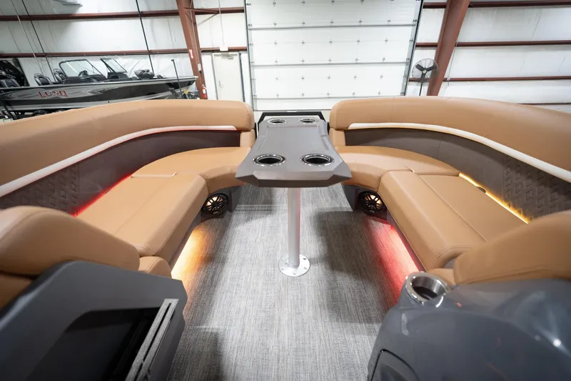Slide: The Image of Luxurious interior of 2026 Bennington 22 MSB pontoon boat with plush seating and ambient lighting. - 21