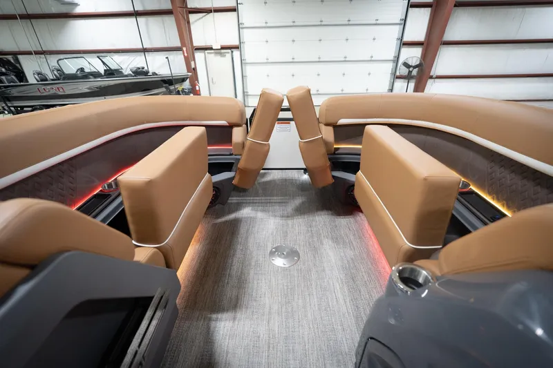Slide: The Image of Luxurious interior of 2026 Bennington 22 MSB pontoon boat with plush seating and ambient lighting. - 23