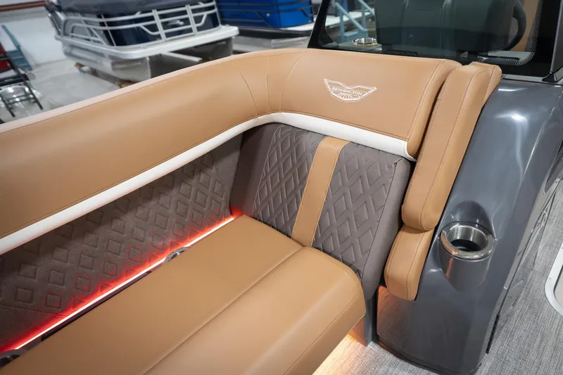 Slide: The Image of Luxurious seating on 2026 Bennington 22 MSB pontoon boat with elegant design and ambient lighting. - 24