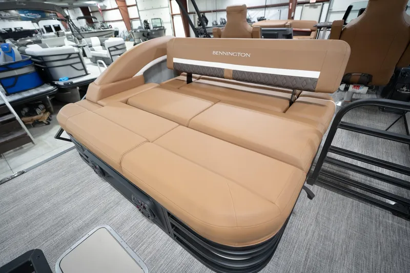 Slide: The Image of 2026 Bennington 22 MSB boat interior with tan seating in showroom. - 32