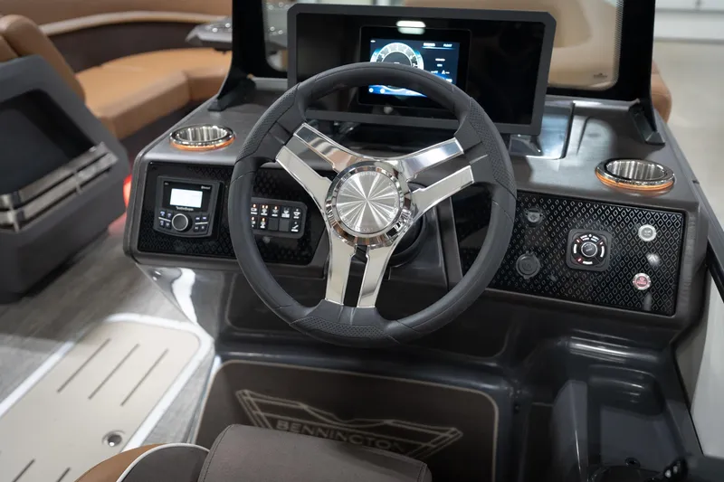 Slide: The Image of 2026 Bennington 22 MSB boat dashboard with steering wheel and control panel. - 37