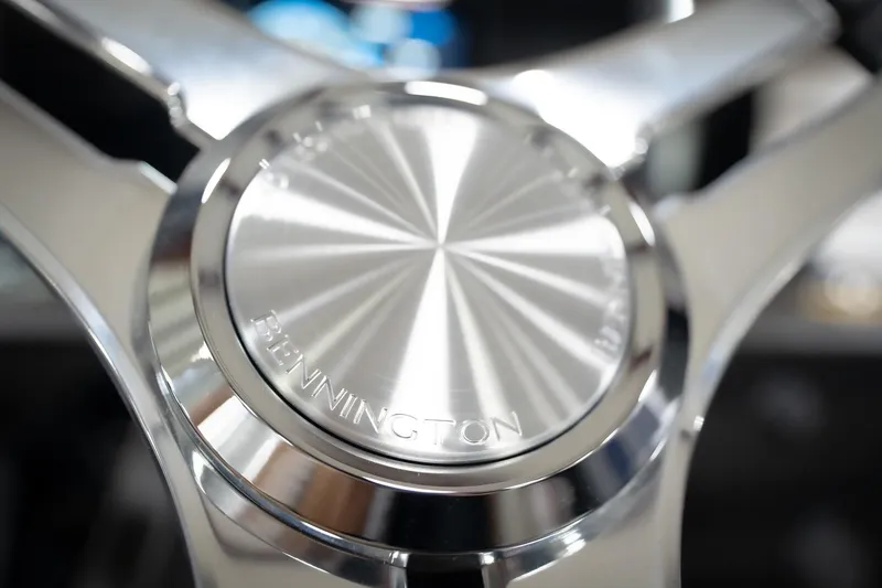Slide: The Image of Close-up of 2026 Bennington 22 MSB steering wheel, showcasing sleek metallic design. - 39