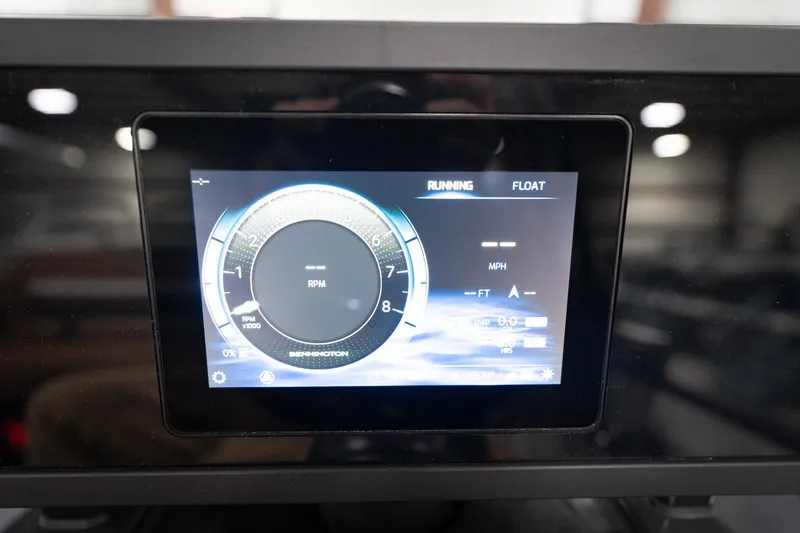 Slide: The Image of Dashboard display of 2026 Bennington 22 MSB showing RPM and speed metrics. - 42