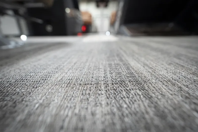 Slide: The Image of Close-up of textured flooring on a 2026 Bennington 22 MSB boat interior. - 53