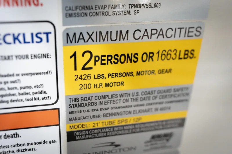 Slide: The Image of 2026 Bennington 22 MSB boat capacity label, 12 persons or 1663 lbs, 200 HP motor. - 61