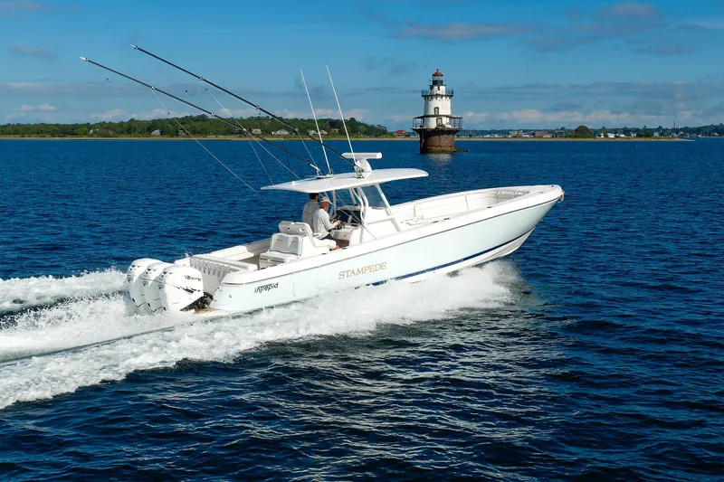 Slide: The Image of 2017 Intrepid 375 Nomad FE cruising near a lighthouse on a sunny day. - 23