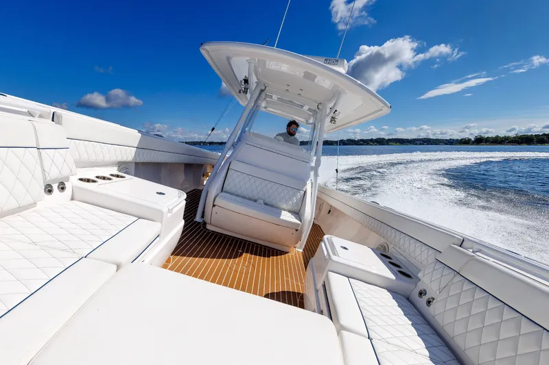 Slide: The Image of 2017 Intrepid 375 Nomad FE cruising on a sunny day, showcasing luxurious seating and sleek design. - 51
