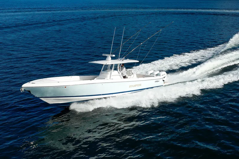 Slide: The Image of 2017 Intrepid 375 Nomad FE boat cruising on open water. - 19